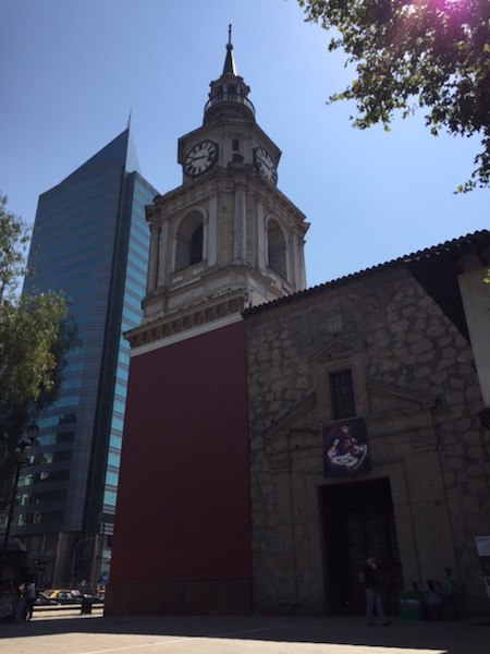 The stone church in the center was built in 1618. The steeple was added much later. As was the modern glass building in the background.